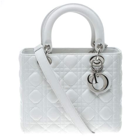 white leather christian dior handbag with single shoulder srap|Christian Dior small leather goods.